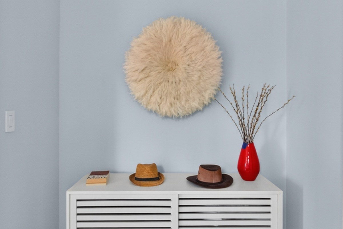 22 West 26th Street entry niche with juju feather art and white credenza